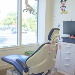 Silicon Valley Pediatric Dentistry and Orthodontics - Private Treatment room with personal TV overhead for patients to choose their entertainment