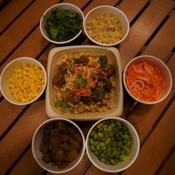 Basil Box - a variety of bowls of food on a wooden table - Thai Near Me - Toronto, Ontario Basil Box - a variety of bowls of food on a wooden table - Thai Near Me - Toronto, Ontario