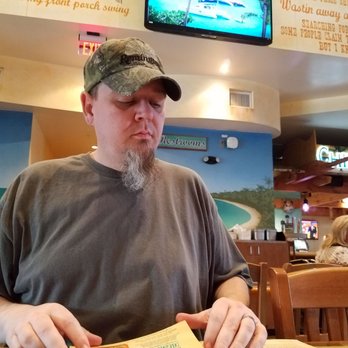 Margaritaville - Pigeon Forge - My hubs looking over the options. I loved all the background designs ! - American Near Me - Pigeon Forge, Tennessee Margaritaville - Pigeon Forge - My hubs looking over the options. I loved all the background designs ! - American Near Me - Pigeon Forge, Tennessee