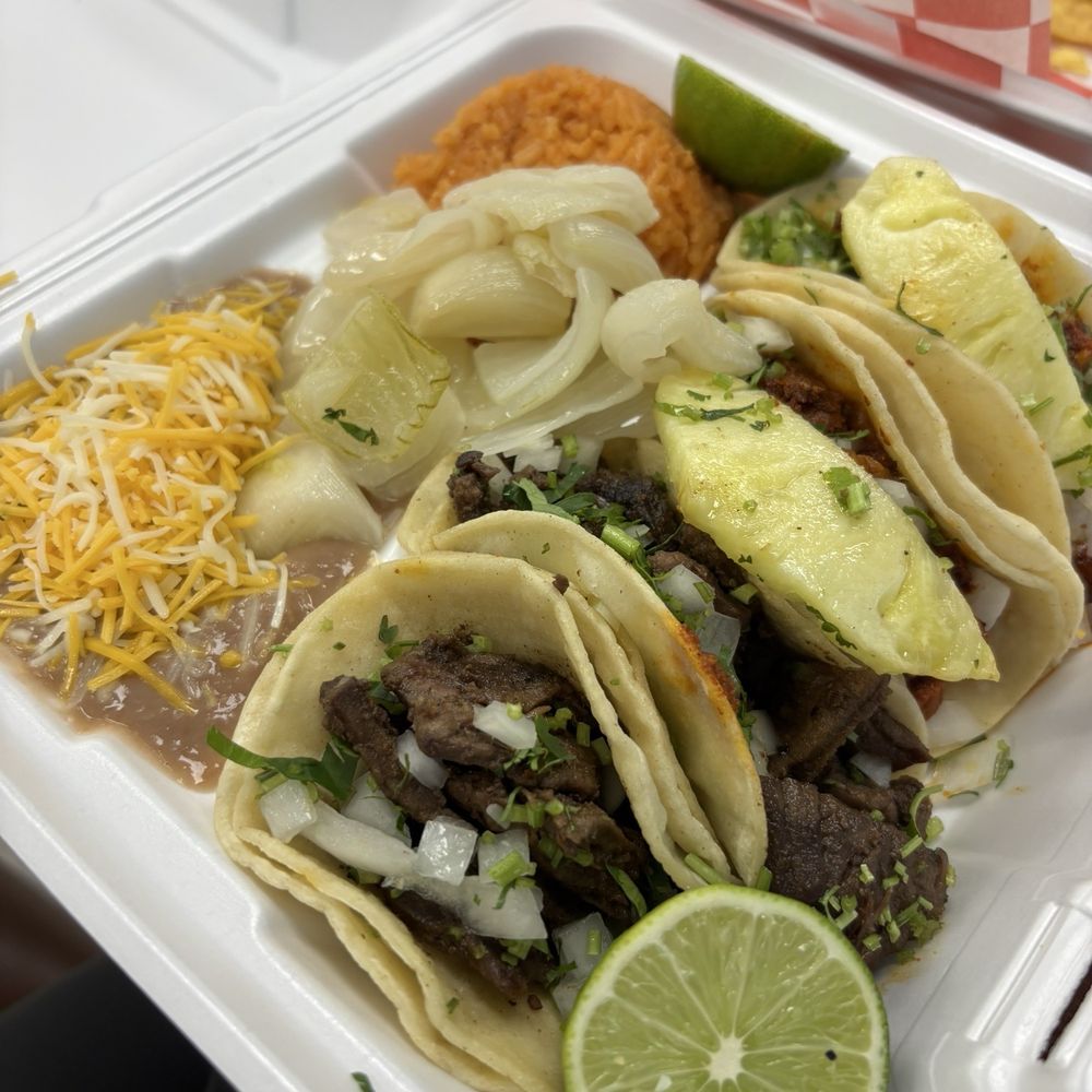 Taco platter: steak tacos and pastor tacos Taco platter: steak tacos and pastor tacos