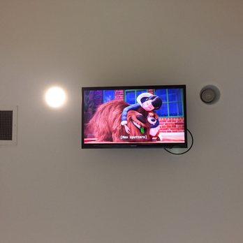 Smith And Bailey Dental - The ceiling-mounted television playing "The Secret Life of Pets". - General Dentistry Near Me - Rainbow City, Alabama Smith And Bailey Dental - The ceiling-mounted television playing "The Secret Life of Pets". - General Dentistry Near Me - Rainbow City, Alabama