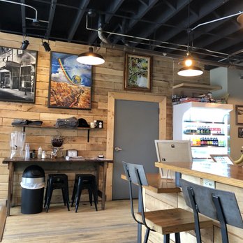 New City Cafe & Roastery - bar seating, cooler and art - Coffee & Tea Near Me - Rochester, New York
