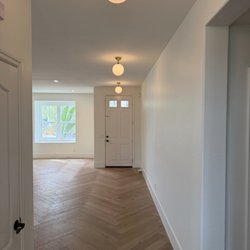 Custom Electric SD - Decorative hallway ceiling light installation, adding modern style and beautiful lighting throughout the space. Custom Electric SD.