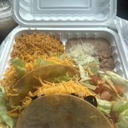 2 Crispy Tacos with rice n beans. Very good! Shredded beef that was flavorful and not dry.