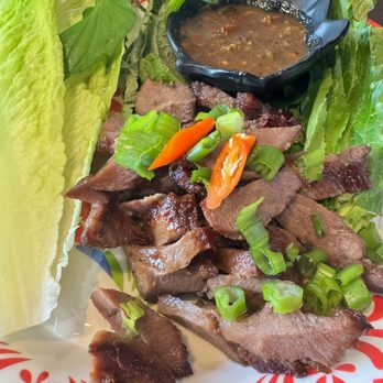 The Crying Tiger - Beef tongue with bitter sauce. This is definitely for those who wants to adventure. The sauce is very pungent and bitter. - Laotian Near Me - Largo, Florida The Crying Tiger - Beef tongue with bitter sauce. This is definitely for those who wants to adventure. The sauce is very pungent and bitter. - Laotian Near Me - Largo, Florida