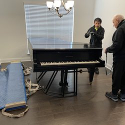 Norbert's Piano Service - Nobert and Robert getting the piano prepared