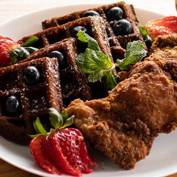 Bleu Fin Bar & Grill - a plate of waffles and strawberries - Seafood Near Me - Brooklyn, New York Bleu Fin Bar & Grill - a plate of waffles and strawberries - Seafood Near Me - Brooklyn, New York