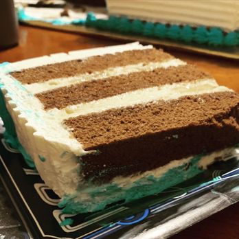Cakes by Javi - a slice of cake on a plate - Custom Cakes Near Me