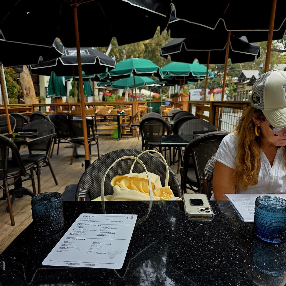 230 Forest Avenue - My friend checking out the menu at the restaurant. Outdoor seating. - Bars Near Me - Laguna Beach, California 230 Forest Avenue - My friend checking out the menu at the restaurant. Outdoor seating. - Bars Near Me - Laguna Beach, California