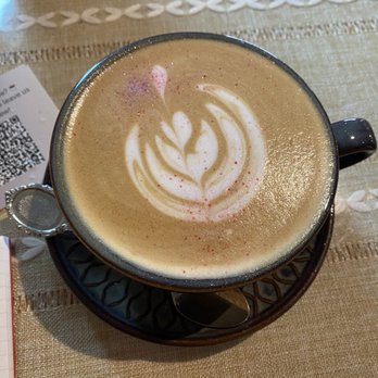 Vintage Cafe - Caramel latte. It was Valentines Day so they put some edible pink glitter in the coffee - Coffee & Tea Near Me - Schaumburg, Illinois