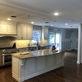 Double V Contracting - a kitchen with a center island - General Contractors Near Me Double V Contracting - a kitchen with a center island - General Contractors Near Me