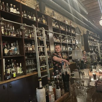 Péché - The bar with a ladder to get to those top shelf bottles - Lounges Near Me - Austin, Texas