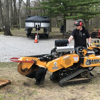 Ground Up Stump Grinding - a man using a stump grinder - Landscaping Near Me Ground Up Stump Grinding - a man using a stump grinder - Landscaping Near Me