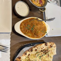 Chicken Biryani, vindaloo, garlic naan Chicken Biryani, vindaloo, garlic naan