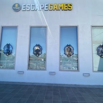 Escape Games at The River - Windows outside with logos of their rooms - Escape Games Near Me - Rancho Mirage, California