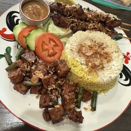 Chicken Satay, tempeh, and coconut & Tumeric rice.