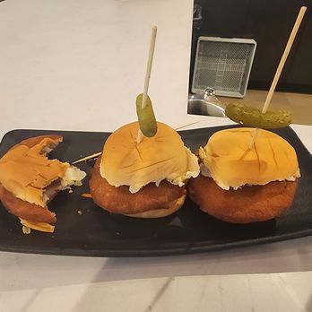 Painted RiNo Kitchen + Bar - Pre formed breaded disc with a barely dollape of coleslaw and gherkin pickle. - Bars Near Me - Denver, Colorado