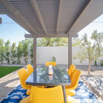 GLS Landscaping - a patio with a table and yellow chairs - Landscaping Near Me - Desert Hot Springs, California GLS Landscaping - a patio with a table and yellow chairs - Landscaping Near Me - Desert Hot Springs, California