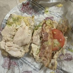 Penn Station - undercooked bacon on a club sandwich