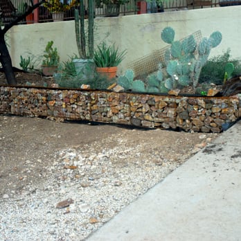 Sonoran Landscape Materials - Coronado Brown rip-rap in a gabion basket terrace wall. - Nurseries & Gardening Near Me - Tucson, Arizona Sonoran Landscape Materials - Coronado Brown rip-rap in a gabion basket terrace wall. - Nurseries & Gardening Near Me - Tucson, Arizona