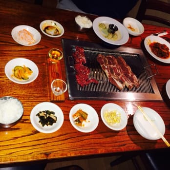 Sam Won Garden Restaurant - Galbi and Jumulreok on the grill and delicious banchan!! Don't forget the sesame oil sauce and gochuchang!! - Korean Near Me - Jacksonville, Florida