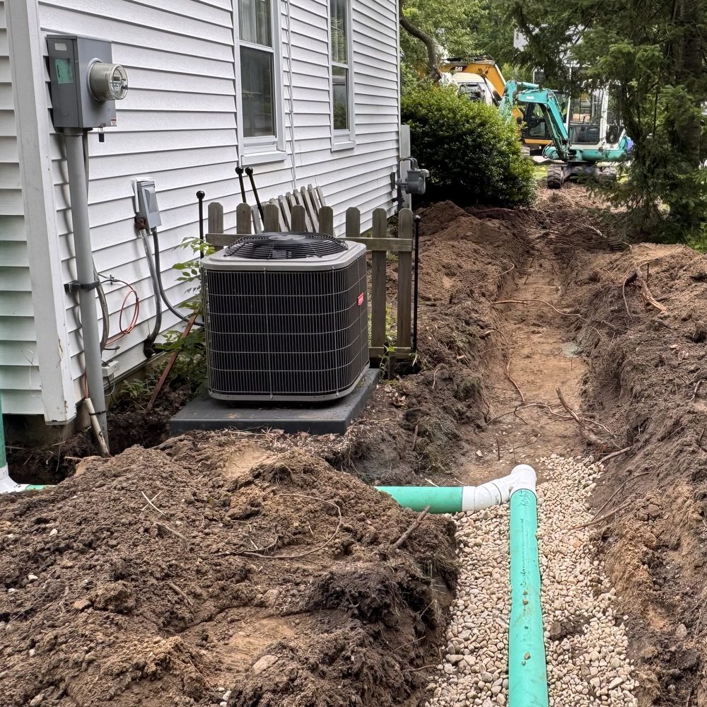 Knight's Grading & Excavating - Drain solution to mitigate water from a backyard and redirect it out to the front yard rain garden. - Waterproofing Near Me - Pinckney, Michigan Knight's Grading & Excavating - Drain solution to mitigate water from a backyard and redirect it out to the front yard rain garden. - Waterproofing Near Me - Pinckney, Michigan