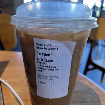 Starbucks - Iced Caff Latte with Oatmilk, Toffee Nut Syrup, and Cinnamon Powder on top - Coffee & Tea Near Me - San Diego, California