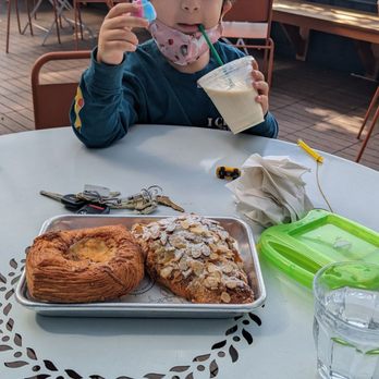 The Flora Bakehouse - Twice baked almond, partially eaten unicorn horn, vanilla soy milk, onion 3 cheese croissant - Bakeries Near Me - Seattle, Washington