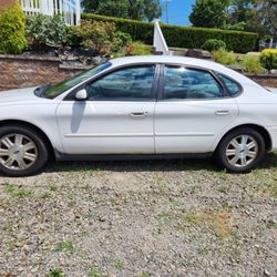 Burrell Auto Wreckers - 2005 ford taurus: good body and interior, engine starts and runs good but not drivable. Clean title