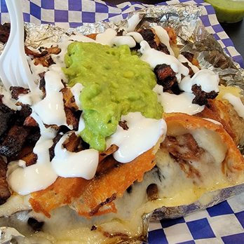 Tacos El Callejon - Loaded potato de Adobada! With melted orange crispy cheese, topped off with sour cream and guac - Tacos Near Me - Colton, California Tacos El Callejon - Loaded potato de Adobada! With melted orange crispy cheese, topped off with sour cream and guac - Tacos Near Me - Colton, California