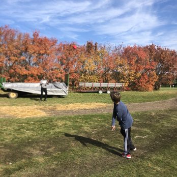 Applewood Orchard - Tossing a football we brought - Pick Your Own Farms Near Me - Lakeville, Minnesota