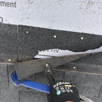 All Exteriors Plus - A shingle that was not fully removed during a repair yet then shingled over again with high nails causing leaks - General Contractors Near Me - Janesville, Wisconsin All Exteriors Plus - A shingle that was not fully removed during a repair yet then shingled over again with high nails causing leaks - General Contractors Near Me - Janesville, Wisconsin