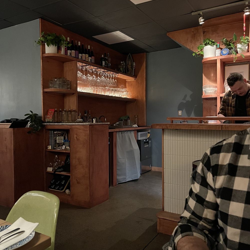 Island Oysters - a man sitting at a bar - Caterers Near Me - Toronto, Ontario Island Oysters - a man sitting at a bar - Caterers Near Me - Toronto, Ontario
