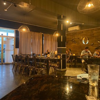 XO Restaurant - Dining room from the view of the plant wall - spacious and COVID friendly! - Asian Fusion Near Me - Honolulu, Hawaii
