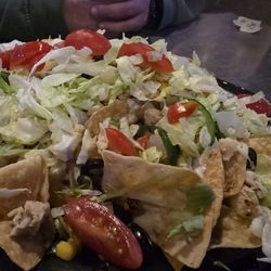 Rudino's Sports Corner - Sports bar nachos ordered with extra cheese should not be raw veggies w/ 1 oz. of cheese and a few small pieces of bland chicken.