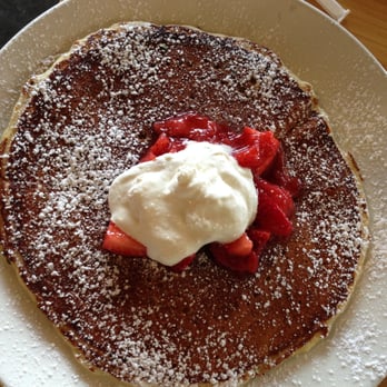 Early Bird - one griddle pancake. topped with whipped cream and strawberries. - New American Near Me - Fullerton, California