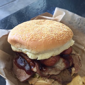 Rate Field - BBQ sandwich - jalapeño cheddar brats, piled pork, brisket, pickles, bbq sauce - Stadiums & Arenas Near Me - Chicago, Illinois Rate Field - BBQ sandwich - jalapeño cheddar brats, piled pork, brisket, pickles, bbq sauce - Stadiums & Arenas Near Me - Chicago, Illinois