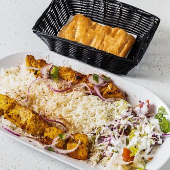 Ariana Restaurant - Chicken Tikka Kebab ($19.99) - two skewers of saffron-marinated chicken grilled over charcoal, with basmati rice, salad and warm bread. - Afghan Near Me - Newark, California Ariana Restaurant - Chicken Tikka Kebab ($19.99) - two skewers of saffron-marinated chicken grilled over charcoal, with basmati rice, salad and warm bread. - Afghan Near Me - Newark, California