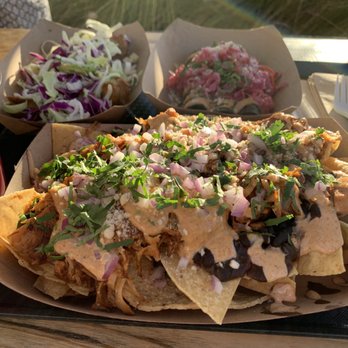 Seabirds Kitchen - Clockwise from bottom: Jackfruit Nachos, Blackberry Lemonade, Beer Battered Avocado Tacos, Purple Taquitos - Vegan Near Me - Costa Mesa, California Seabirds Kitchen - Clockwise from bottom: Jackfruit Nachos, Blackberry Lemonade, Beer Battered Avocado Tacos, Purple Taquitos - Vegan Near Me - Costa Mesa, California