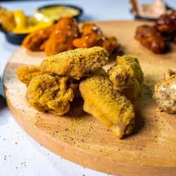 Hot wings at Clutch City Cluckers! Our chicken wings are available in Buffalo, Lemon Pepper, BBQ, Garlic Parm, Sweet & Spicy, or Clutch.