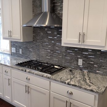 AB Stone Innovation - a kitchen with white cabinets - Flooring Near Me - Madison, Alabama AB Stone Innovation - a kitchen with white cabinets - Flooring Near Me - Madison, Alabama