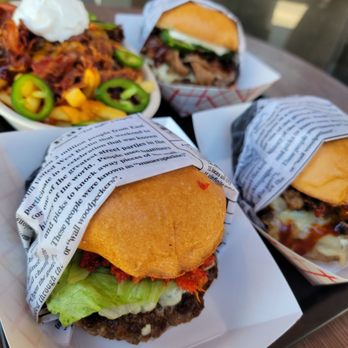 The Brave Burger - three burgers wrapped in paper - Burgers Near Me - Clermont, Florida The Brave Burger - three burgers wrapped in paper - Burgers Near Me - Clermont, Florida