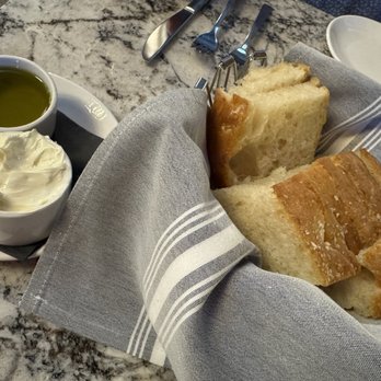 Al'Lupo Ristorante - Bread basket of delicious focaccia made in house. - Italian Near Me - Cincinnati, Ohio Al'Lupo Ristorante - Bread basket of delicious focaccia made in house. - Italian Near Me - Cincinnati, Ohio