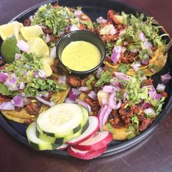 Wings & Burgers To Go - This is the Pastor tacos. They look good, but they are NOT. That green sauce is Mayo and I don't know what. Nasty.