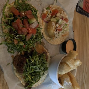 Taqueria Tsunami - Temp Closed - The Quatro Tacos: on the top right shrimp tempura, top left gringo, and bottom left asada. Also with a side of yuca - Asian Fusion Near Me - Roswell, Georgia