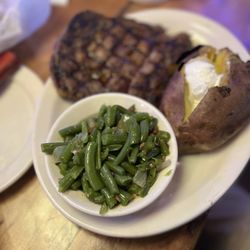 Texas Roadhouse - Small ribeye steak with baked potato and green beans