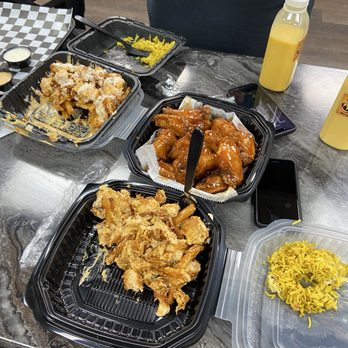 Flavor Hut - Up front: Loaded Nashville chicken fries, middle: Mango Habanero wings, to the left: the rest of the loaded fries. - Burgers Near Me - Camp Hill, Pennsylvania
