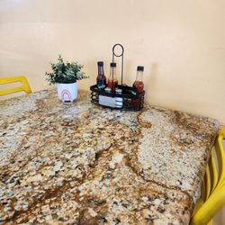 Sunrise Deli - Different sauces on the table and cute plant decor
