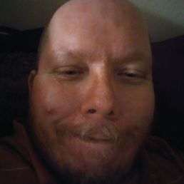 a man with his eyes closed