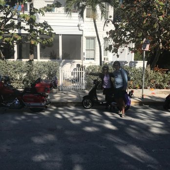 SunShine Scooters - Our little double scooter next to some HARLEYS - Bike Rentals Near Me - Key West, Florida